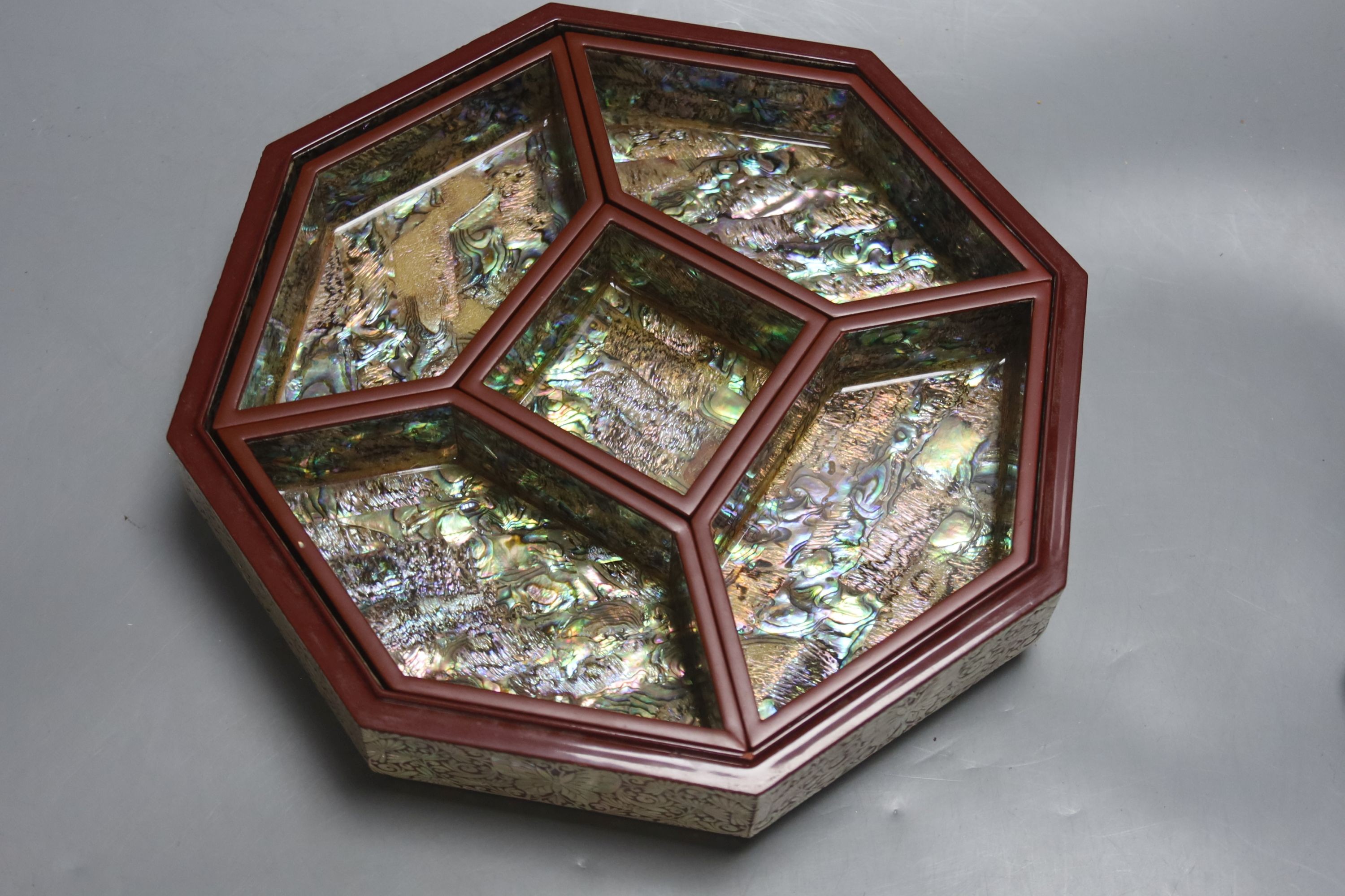 A pair of Japanese ‘Ashinaga’ and ‘Tanaga’ bronze candlesticks, a lacquer and mother-of-pearl inlaid inro and a modern mother-of-pearl and lacquer sectional box and cover